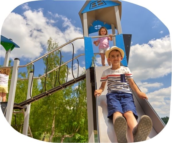 Two children playing on playground equipment