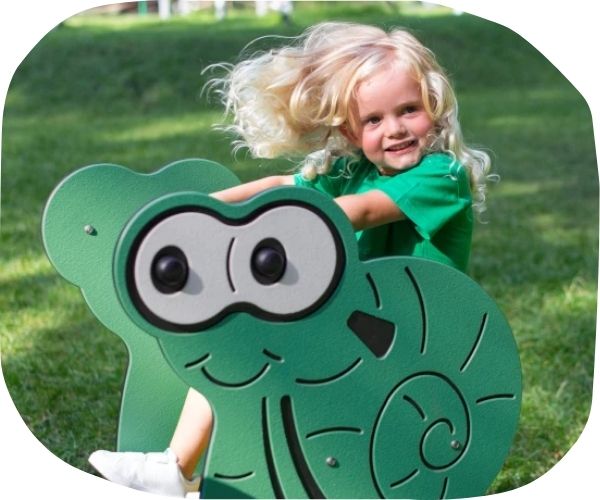 Child rocking on a playground spring rider