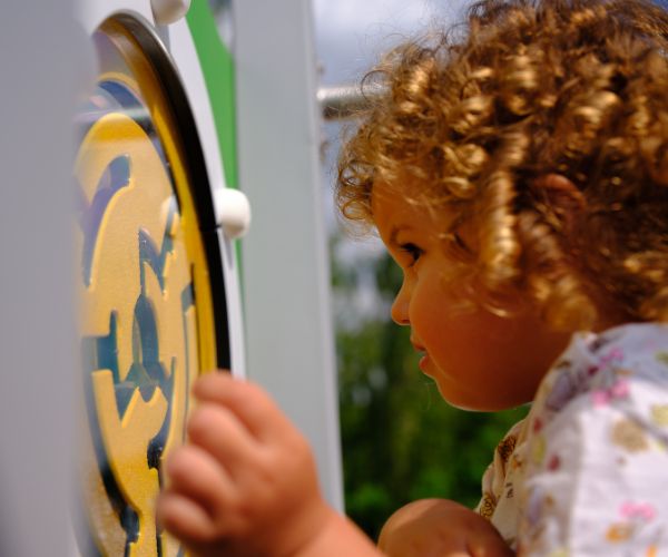 Child playing with play board
