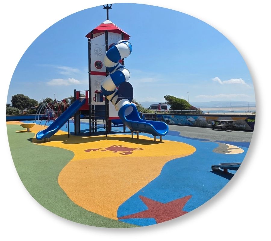 Example of different coloured wetpour safety surfacing on public playground